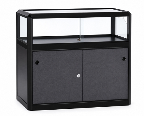 Compacte zwarte toonbankvitrine voor het presenteren van kleine producten en demonstraties.